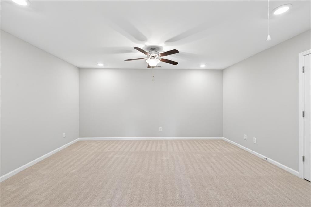 2405 Boxwalking Court Cumming, GA 30040 - Photo 31 of 54 wooden floor in an empty room with a window