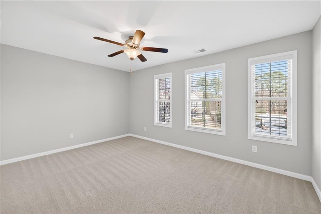 2405 Boxwalking Court Cumming, GA 30040 - Photo 33 of 54 a view of an empty room with a window
