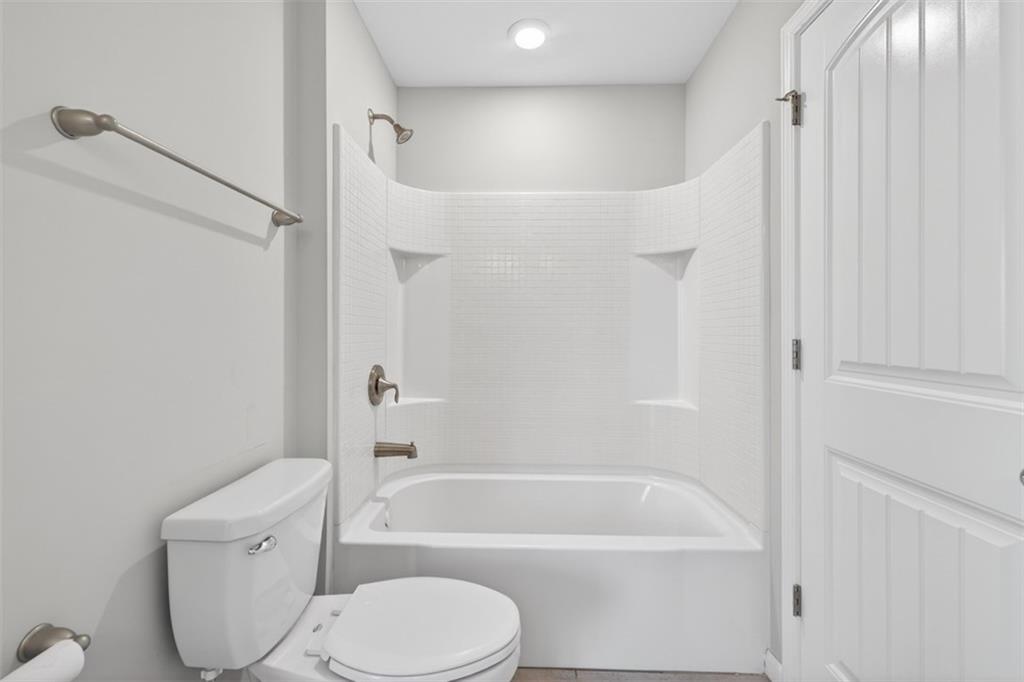 2405 Boxwalking Court Cumming, GA 30040 - Photo 35 of 54 a bathroom with a toilet bathtub and shower