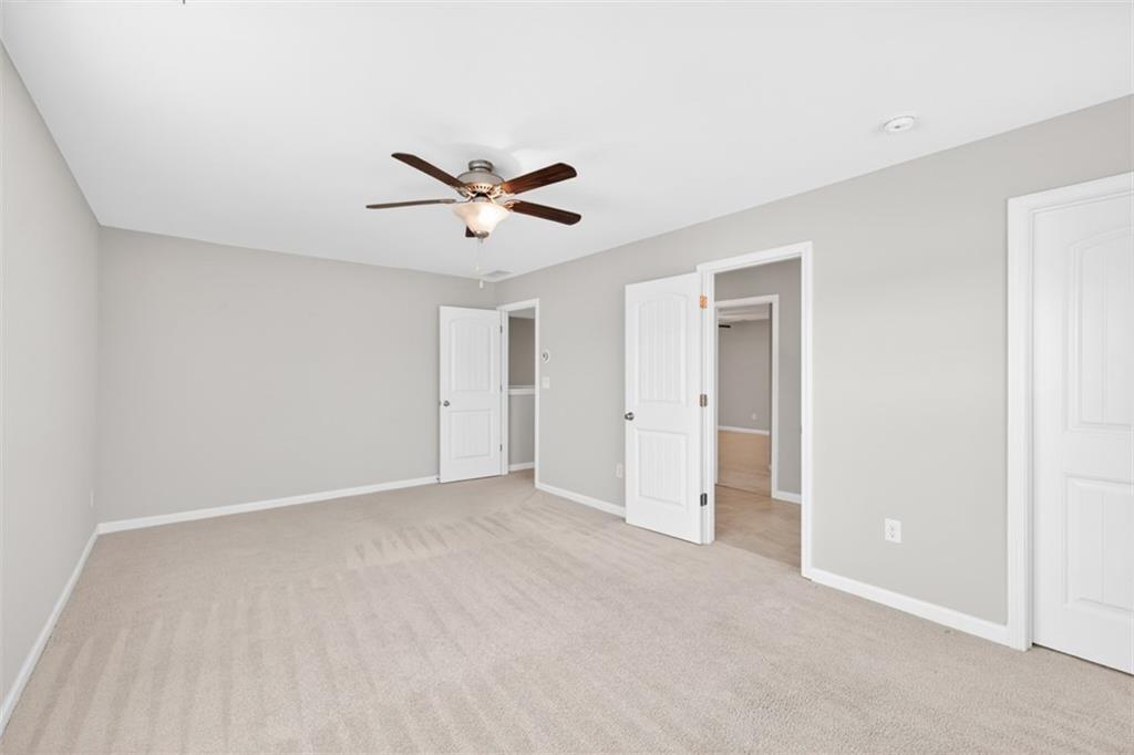 2405 Boxwalking Court Cumming, GA 30040 - Photo 37 of 54 a view of an empty room with a window
