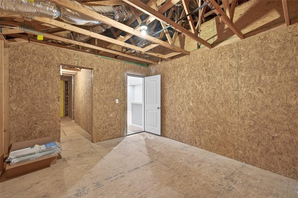 2405 Boxwalking Court Cumming, GA 30040 - Photo 40 of 54 a view of a big room with closet and wooden floor