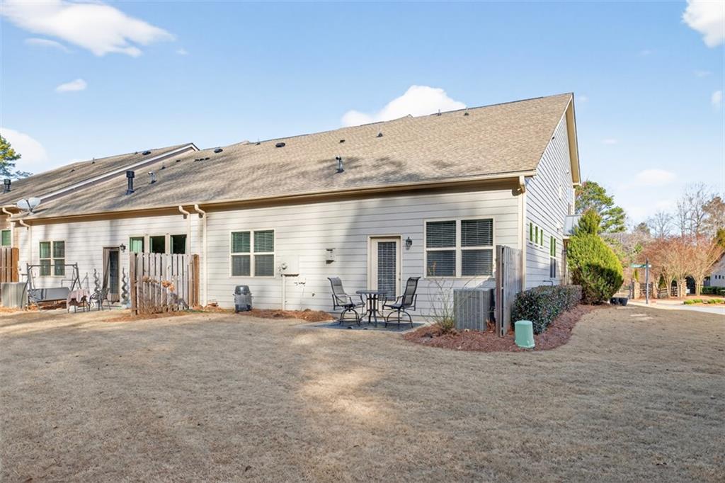2405 Boxwalking Court Cumming, GA 30040 - Photo 42 of 54 a front view of a house with sitting area and chandelier