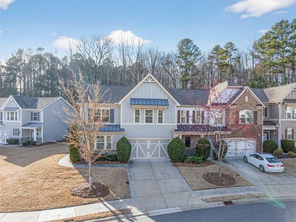 2405 Boxwalking Court Cumming, GA 30040 - Photo 46 of 54 a front view of a house with garden