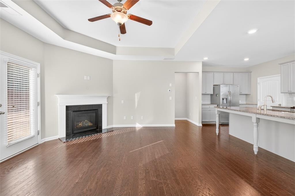 2405 Boxwalking Court Cumming, GA 30040 - Photo 5 of 54 a view of kitchen with sink and wooden floor
