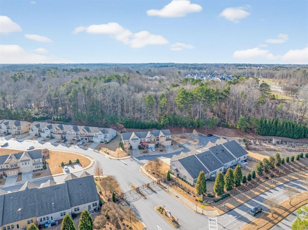 2405 Boxwalking Court Cumming, GA 30040 - Photo 52 of 54 an aerial view of a house with swimming pool and mountains