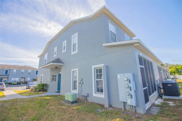 a view of a house with a yard