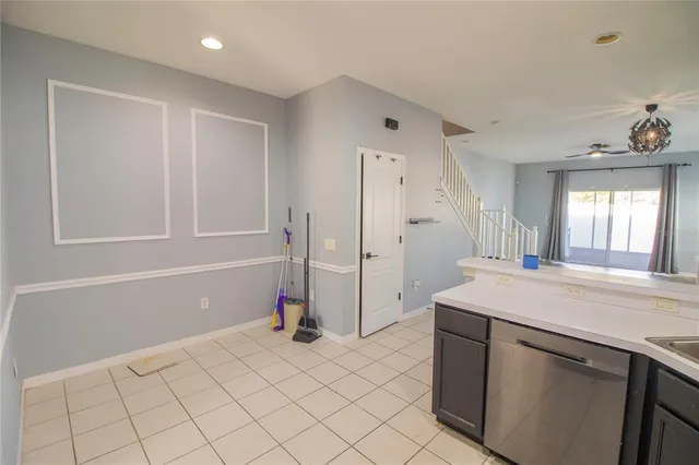 a room with a sink cabinets and utility room