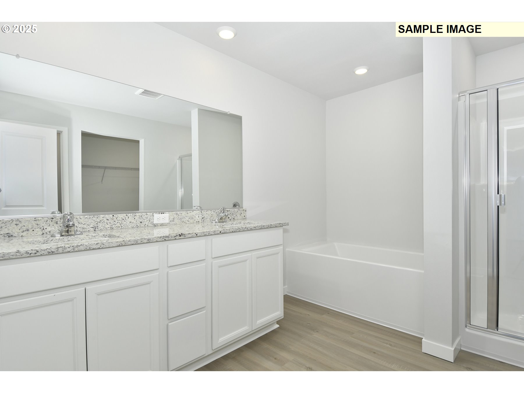 5908 Northeast 68th Street Vancouver, WA 98661 - Photo 14 of 19 a bathroom with a granite countertop sink two mirror and a bathtub