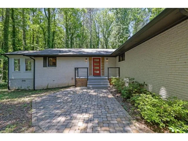 a backyard of a house with lots of green space