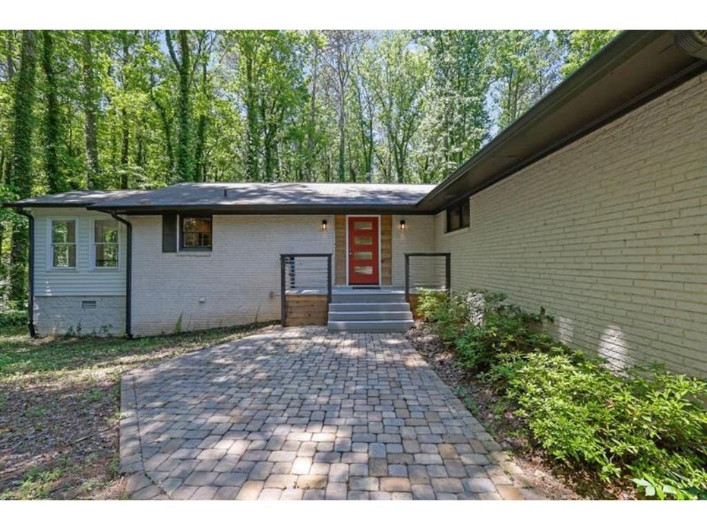 a backyard of a house with lots of green space