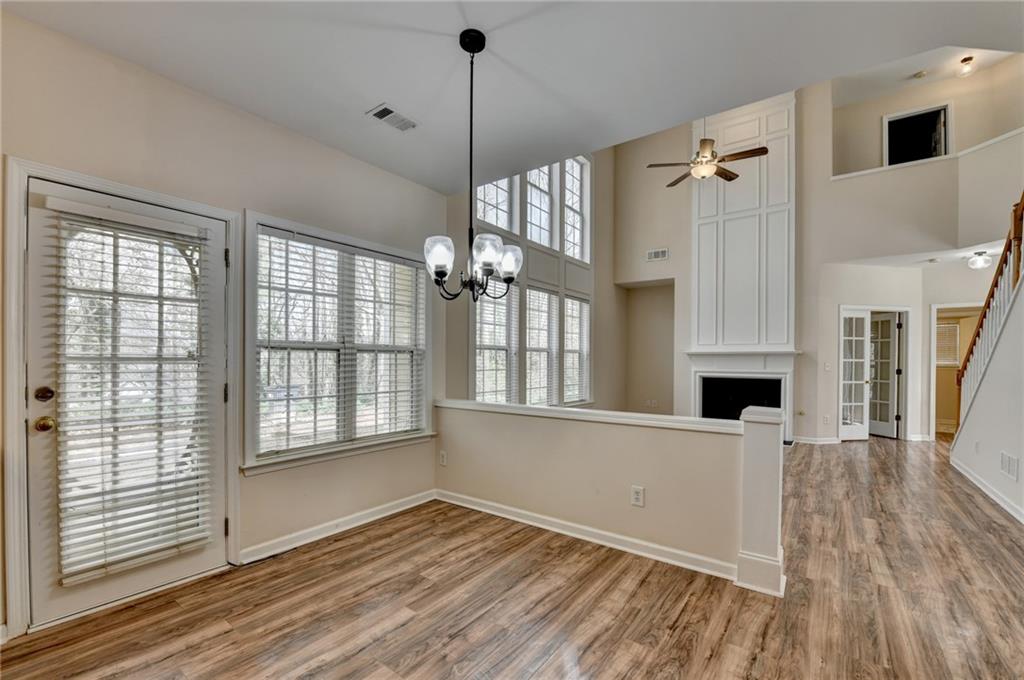 100 Hawnley Trc Northwest Suwanee, GA 30024 - Photo 28 of 58 a view of an empty room with wooden floor and a window
