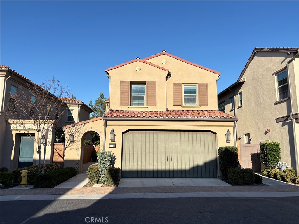 a front view of a house with a garage
