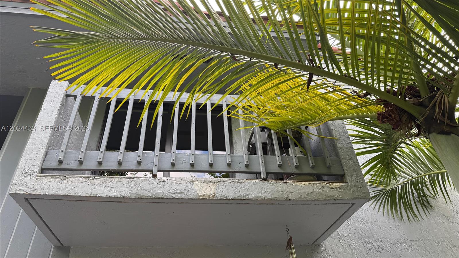 13675 Southwest 62nd Street, Unit 2023 Miami, FL 33183 - Photo 3 of 22 a view of a house with a tree