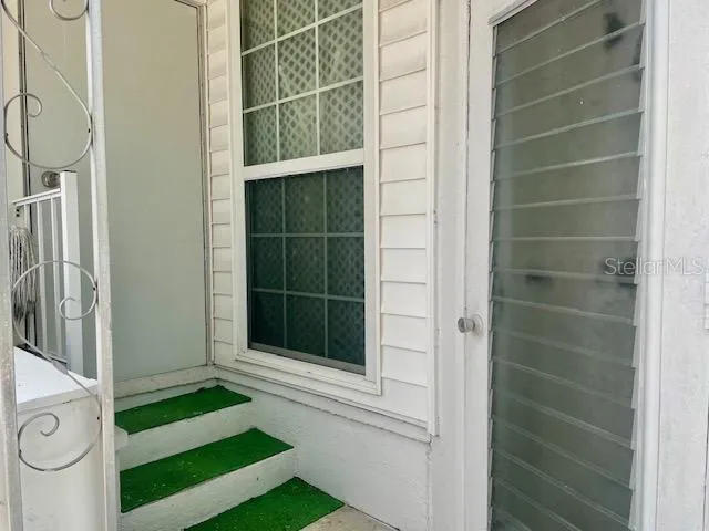 a room with a couch and a window