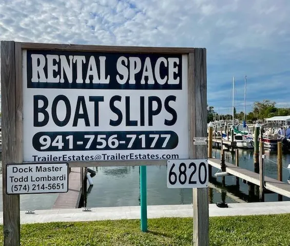 a view of a lake with chairs