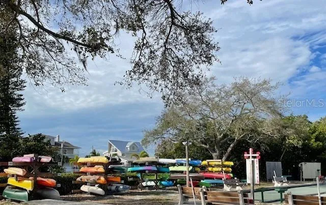 a kitchen with stainless steel appliances kitchen island granite countertop a sink and a stove