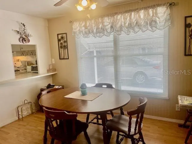 a dining room with furniture and window