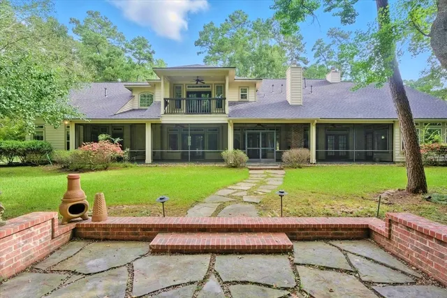a view of a house with a yard porch and sitting area