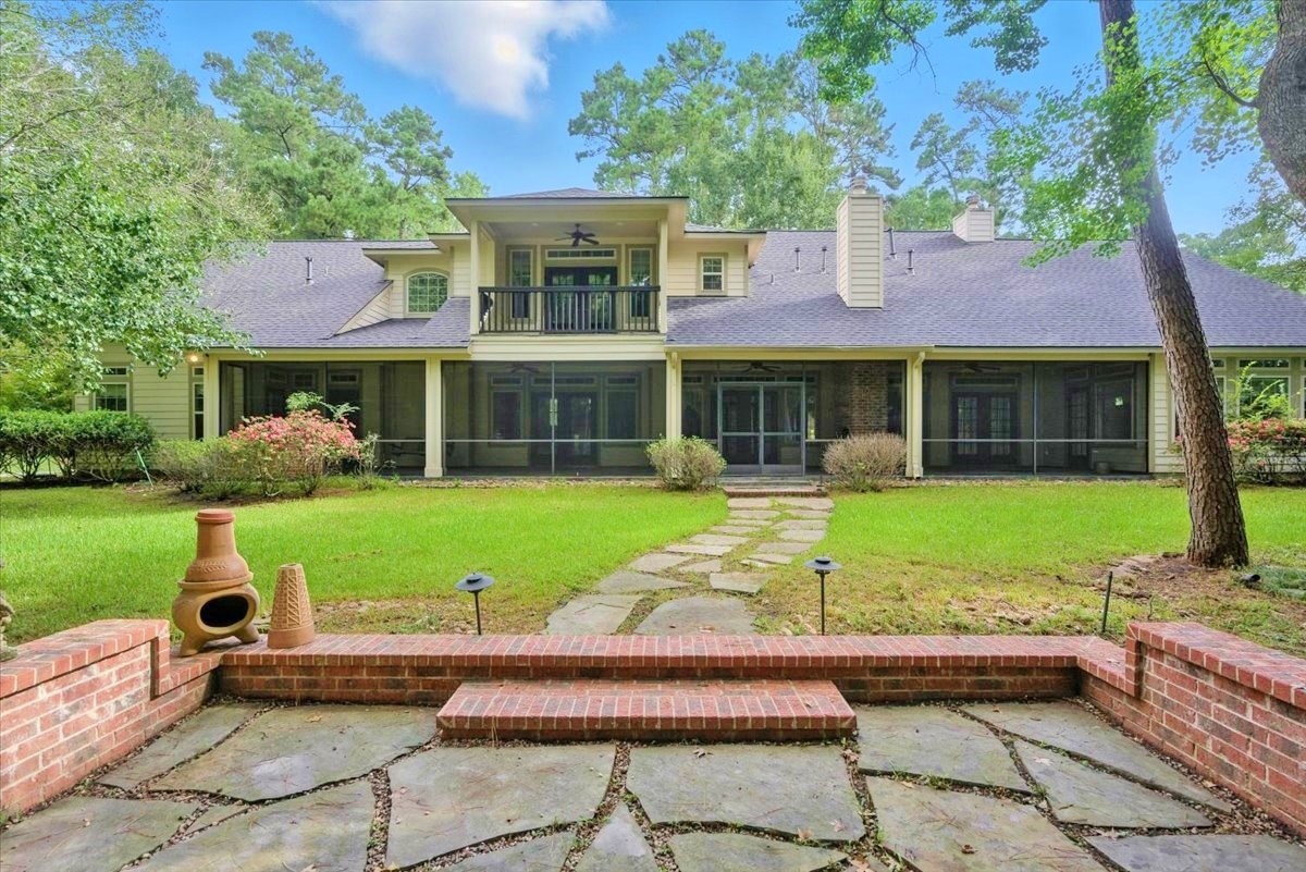 a view of a house with a yard porch and sitting area
