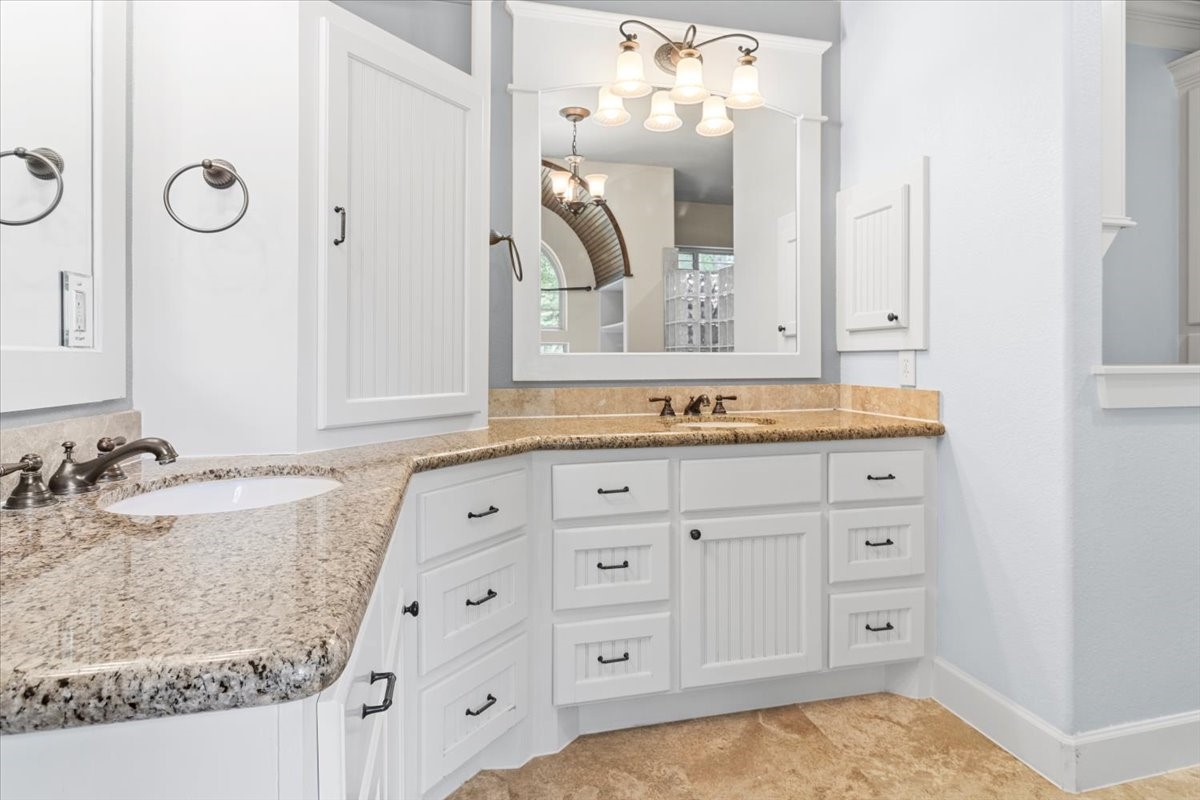 28822 Village Bend Magnolia, TX 77355 - Photo 17 of 45 a bathroom with a granite countertop sink and a mirror