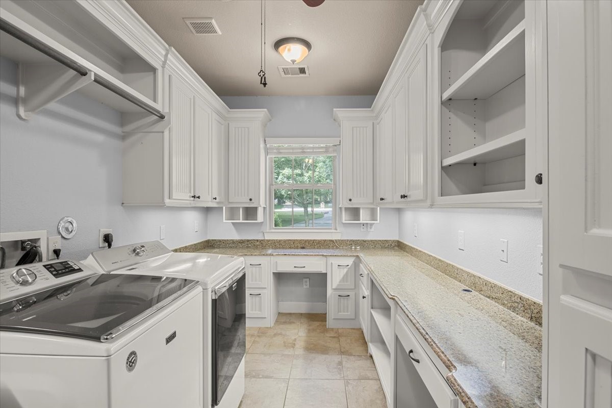 28822 Village Bend Magnolia, TX 77355 - Photo 31 of 45 a kitchen that has a sink and a stove