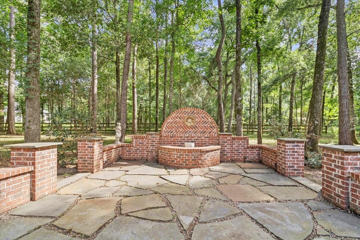 28822 Village Bend Magnolia, TX 77355 - Photo 35 of 45 a large tree in a yard next to a fountain