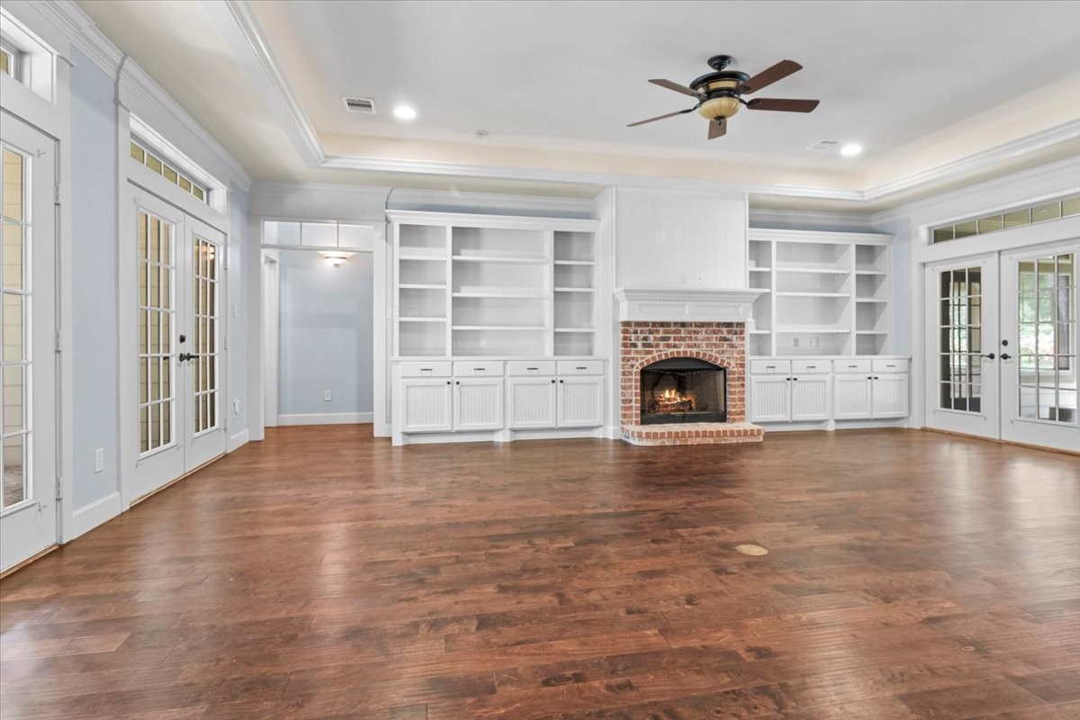 28822 Village Bend Magnolia, TX 77355 - Photo 5 of 45 a view of empty room with fireplace and wooden floor