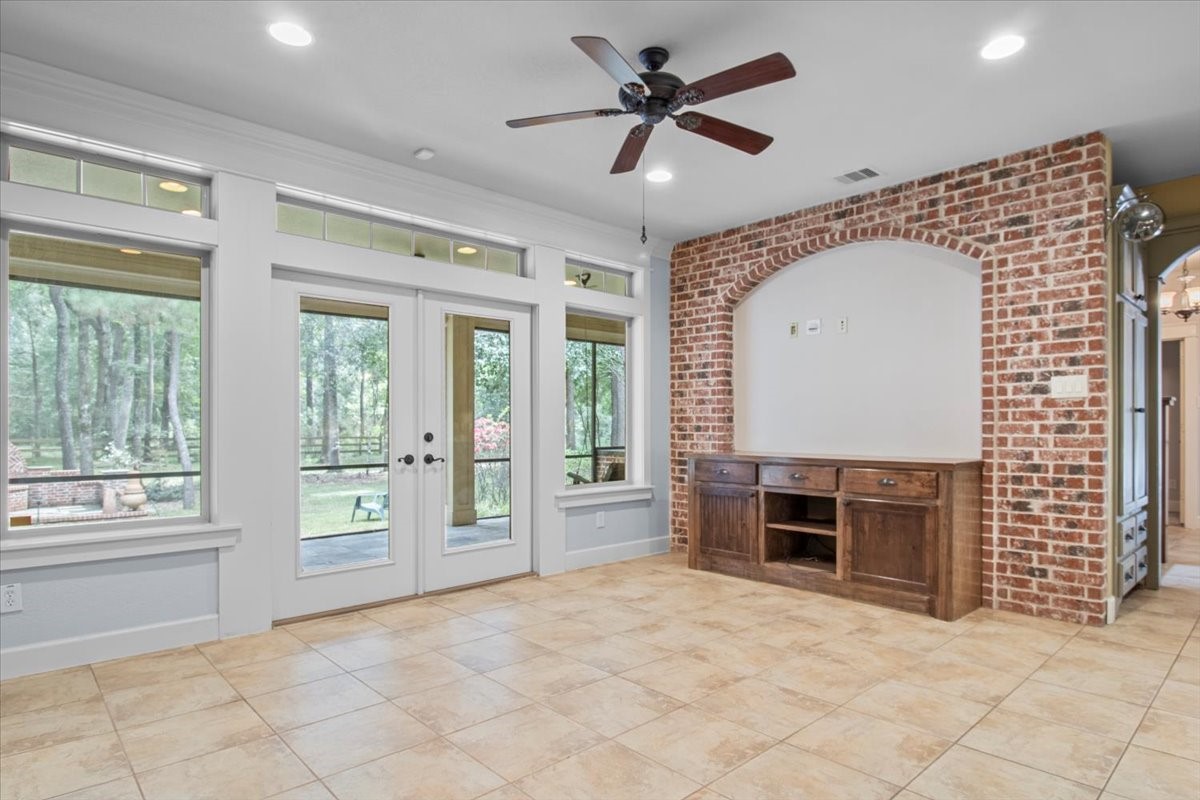 28822 Village Bend Magnolia, TX 77355 - Photo 9 of 45 a view of an empty room with a fireplace and a window