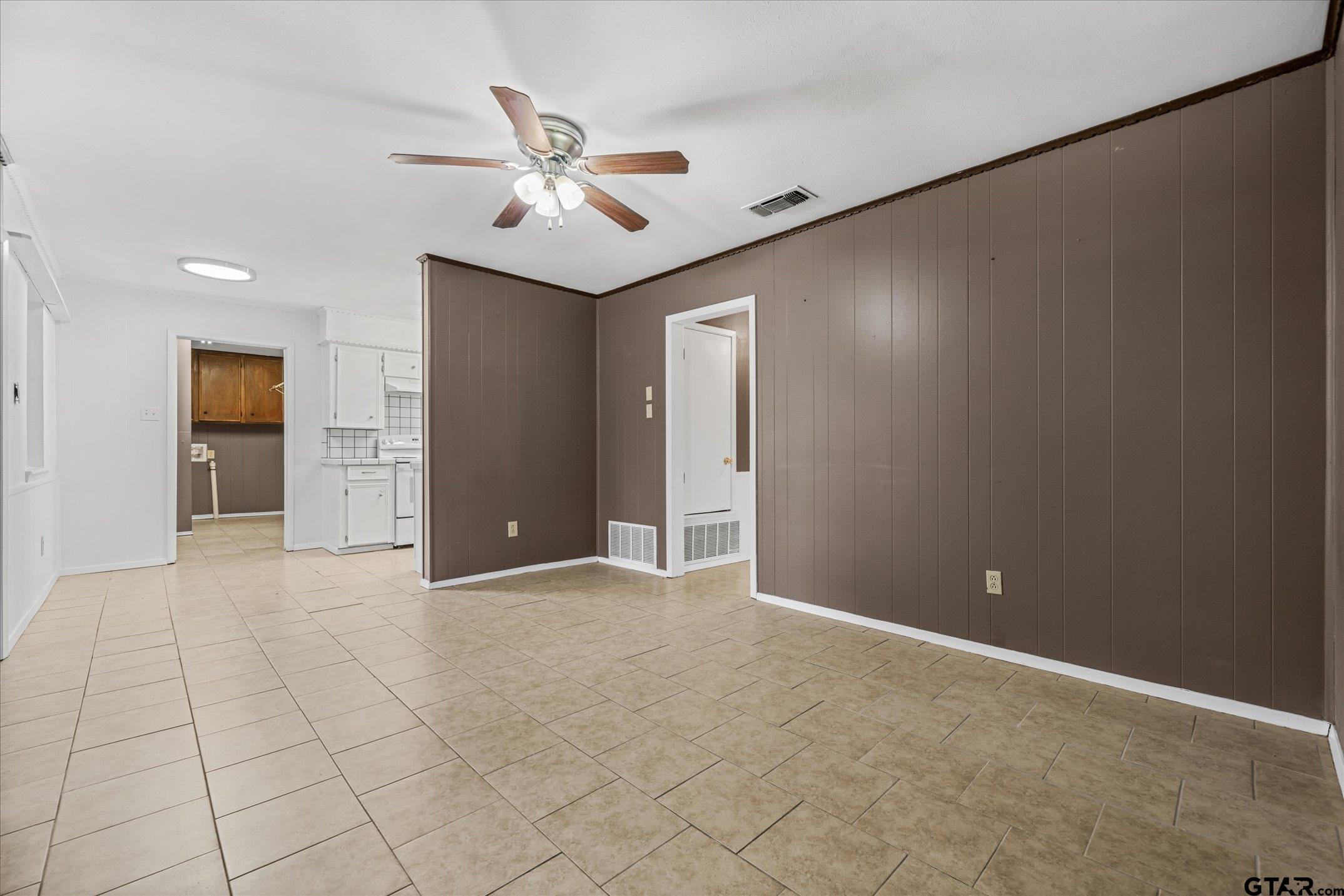 856 Ave A Canton, TX 75103 - Photo 16 of 40 a view of an empty room with a ceiling fan