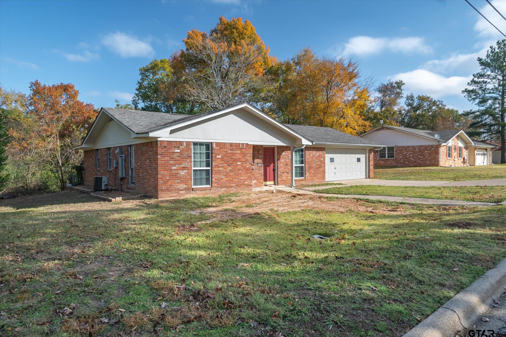 856 Ave A Canton, TX 75103 - Photo 2 of 40 a front view of a house with a garden