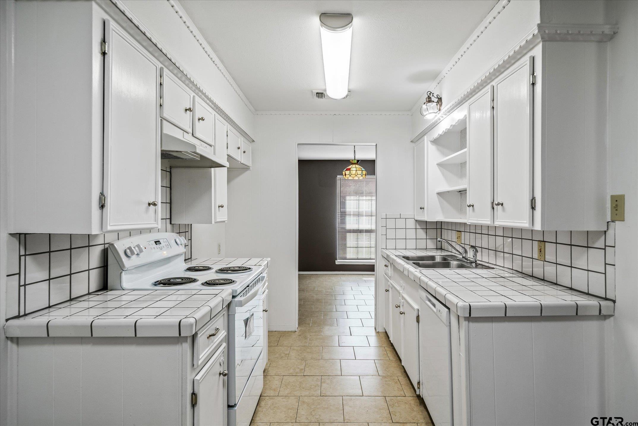 856 Ave A Canton, TX 75103 - Photo 23 of 40 a kitchen that has a sink and a stove