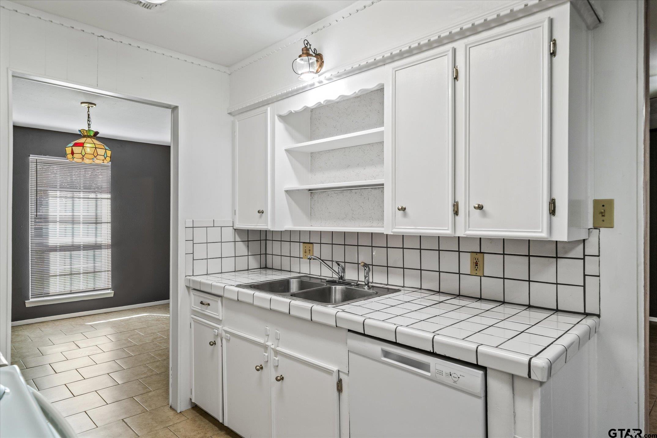 856 Ave A Canton, TX 75103 - Photo 24 of 40 a kitchen with a sink cabinets and utility