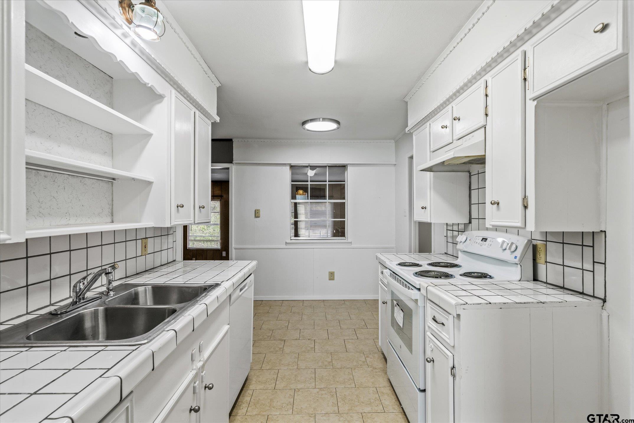 856 Ave A Canton, TX 75103 - Photo 25 of 40 a kitchen that has a sink and a stove