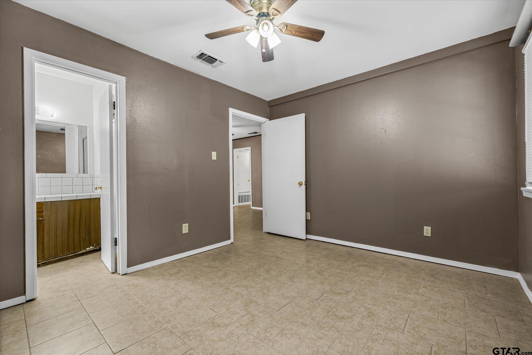856 Ave A Canton, TX 75103 - Photo 29 of 40 a view of an empty room with a ceiling fan