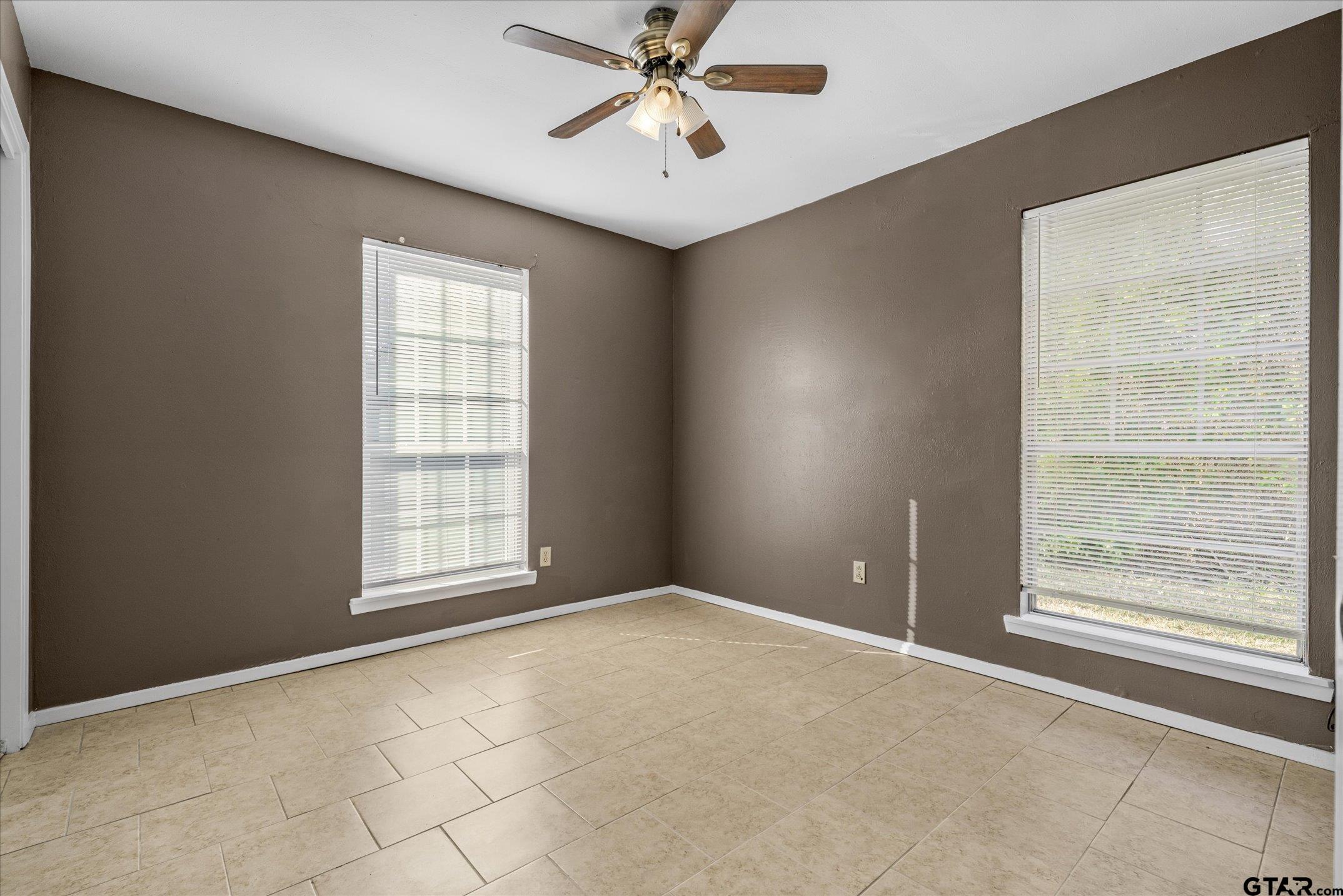 856 Ave A Canton, TX 75103 - Photo 32 of 40 an empty room with windows and fan