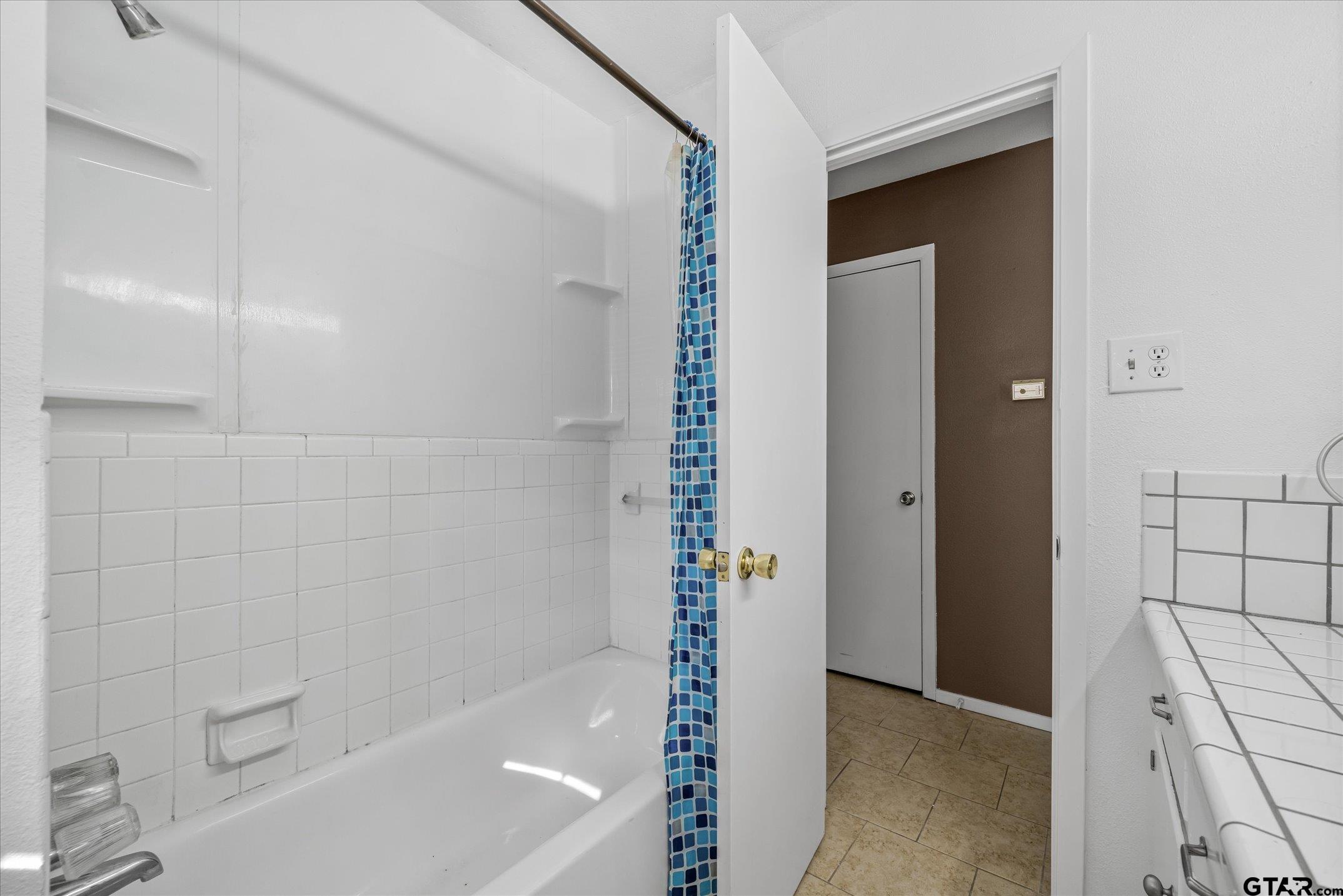 856 Ave A Canton, TX 75103 - Photo 35 of 40 a bathroom with a bathtub and shower