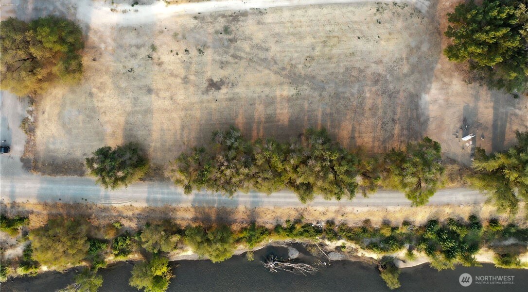 0 Asotin Street South Omak, WA 98841 - Photo 15 of 18 a view of lake with a yard