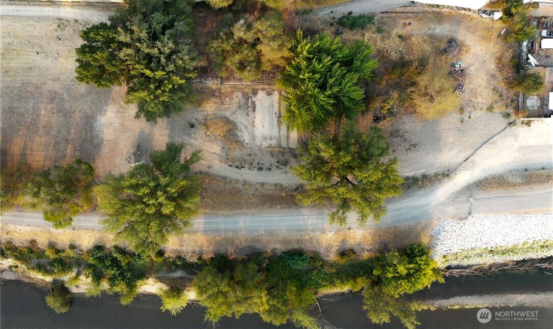 0 Asotin Street South Omak, WA 98841 - Photo 16 of 18 a view of a garden with a lake