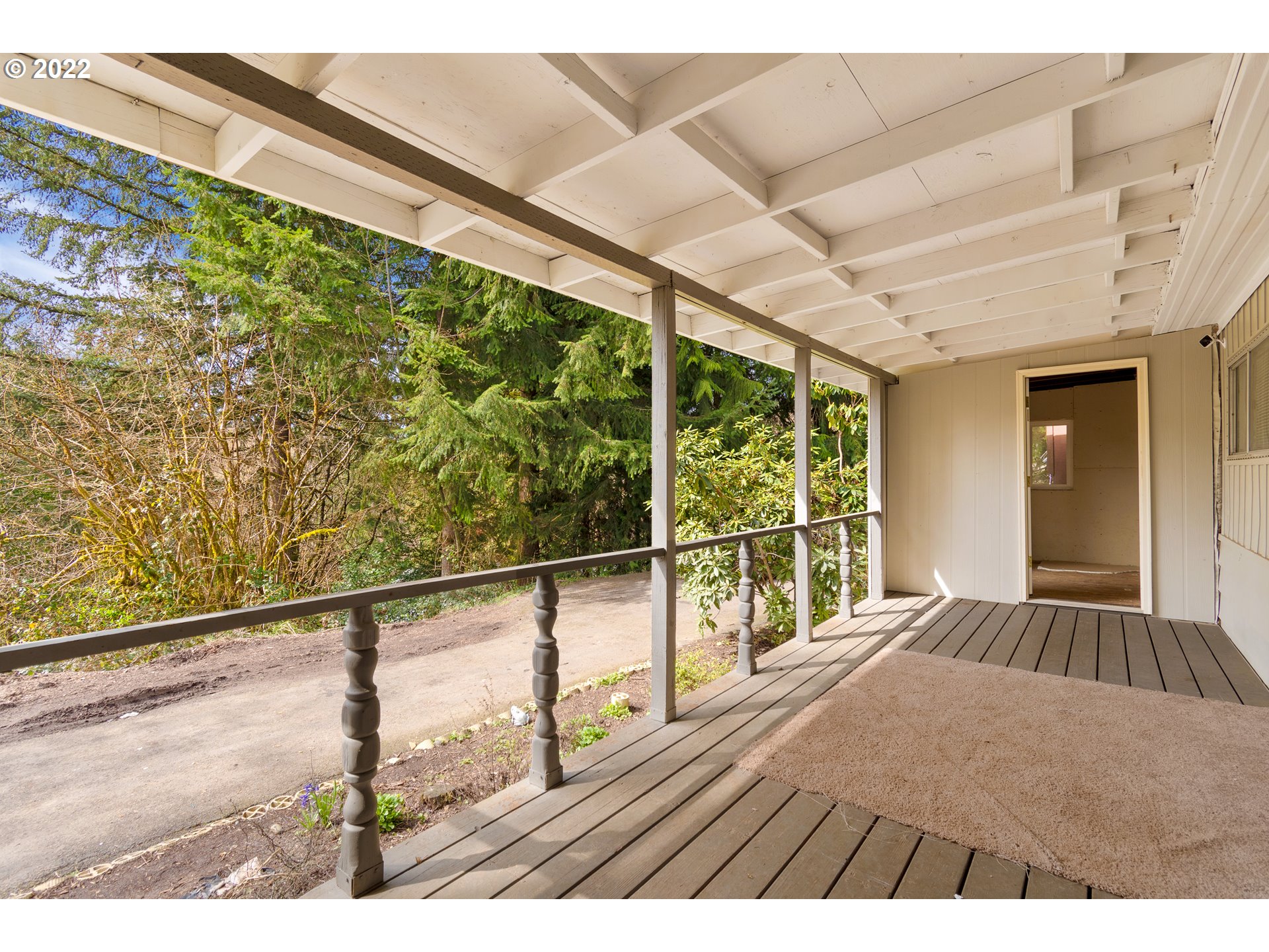 636 Ragland Road Longview, WA 98632 - Photo 23 of 30 a view of balcony with floor to ceiling windows and wooden floor