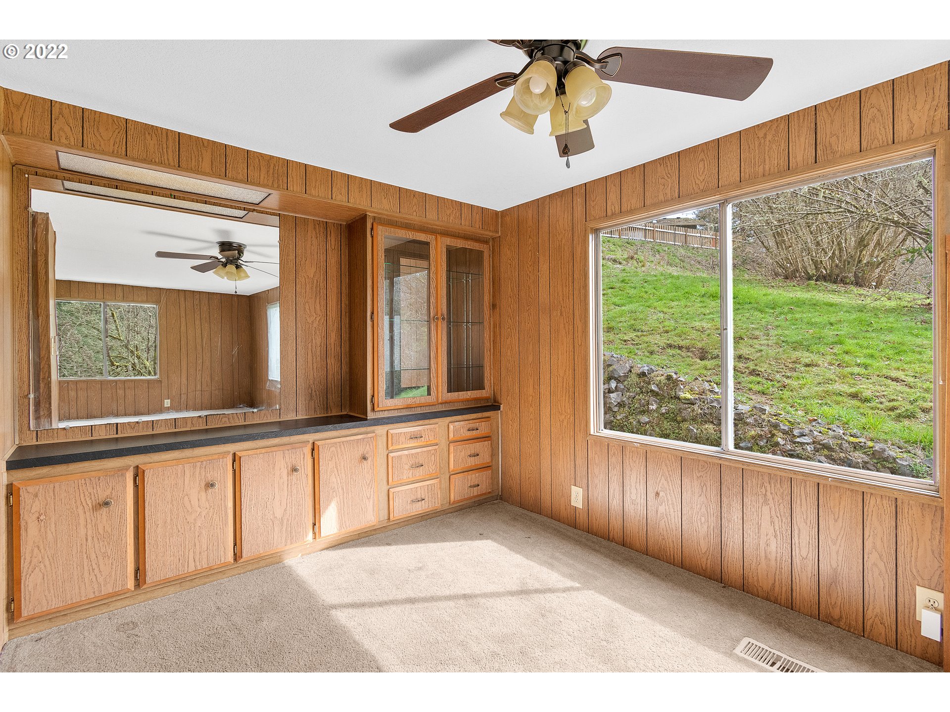 636 Ragland Road Longview, WA 98632 - Photo 9 of 30 a large white kitchen with a large window cabinets and a sink