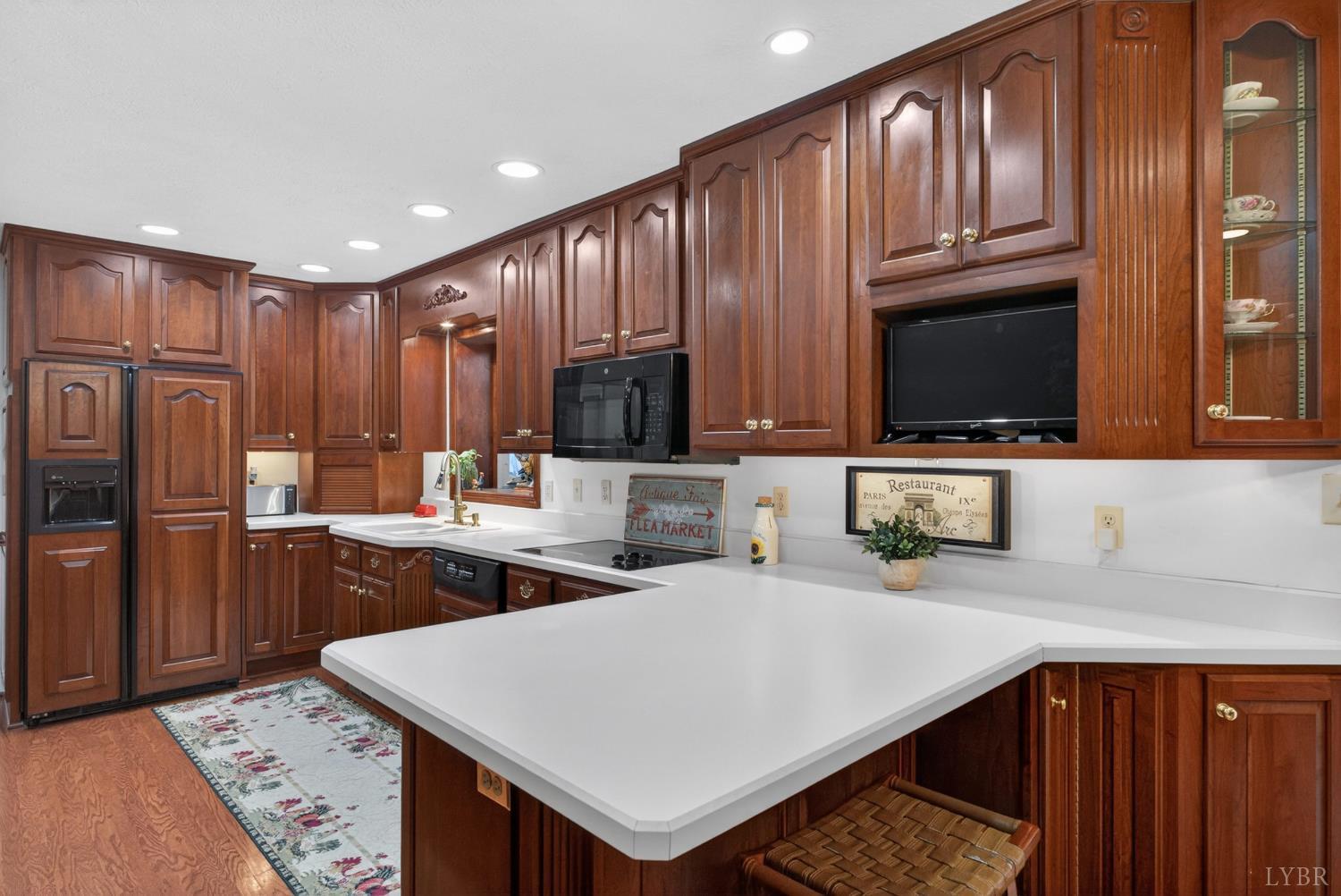 185 Clearview Circle Rustburg, VA 24588 - Photo 13 of 43 a kitchen with stainless steel appliances granite countertop a kitchen island a cabinets a sink and a refrigerator