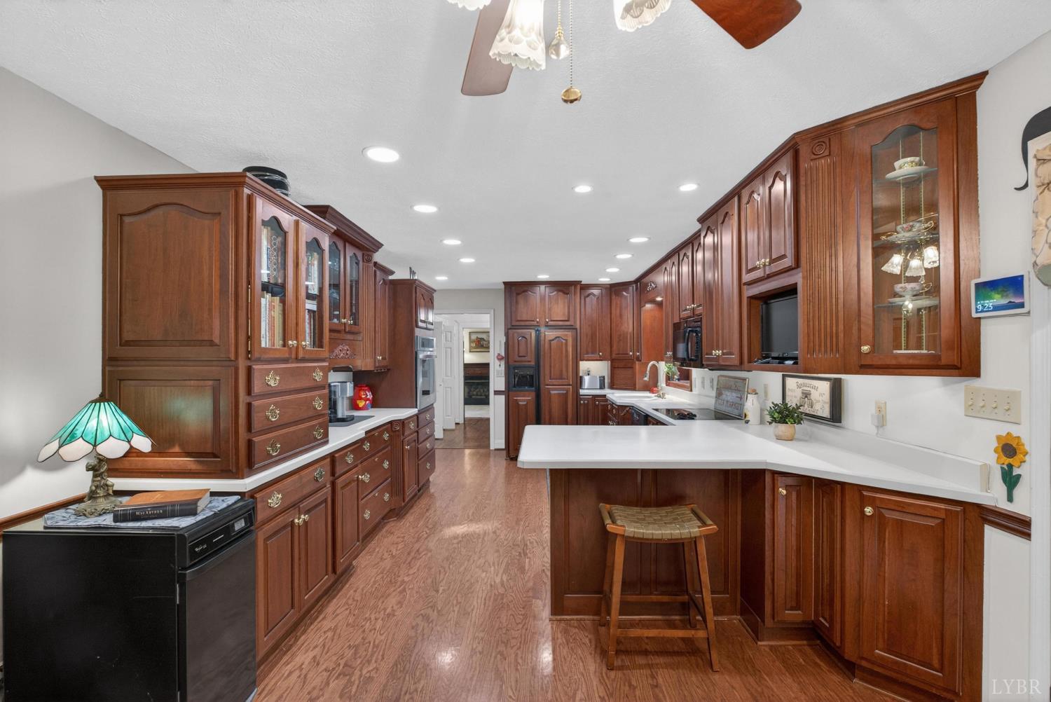 185 Clearview Circle Rustburg, VA 24588 - Photo 15 of 43 a kitchen with stainless steel appliances granite countertop a table chairs sink and cabinets
