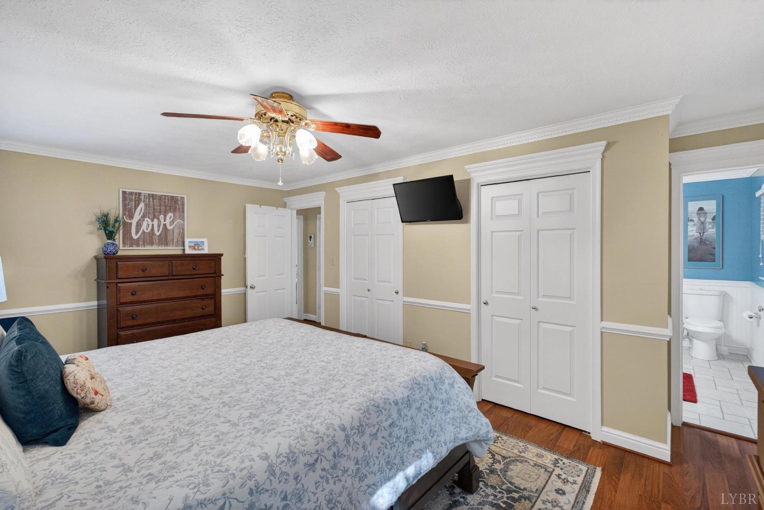 185 Clearview Circle Rustburg, VA 24588 - Photo 21 of 43 a bedroom with a bed and a chandelier