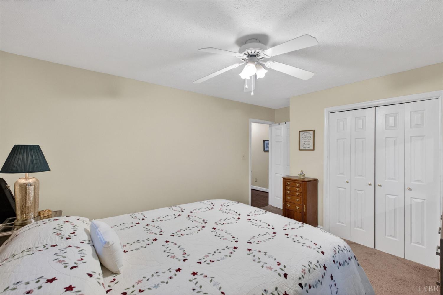 185 Clearview Circle Rustburg, VA 24588 - Photo 24 of 43 a bedroom with a bed and a chandelier