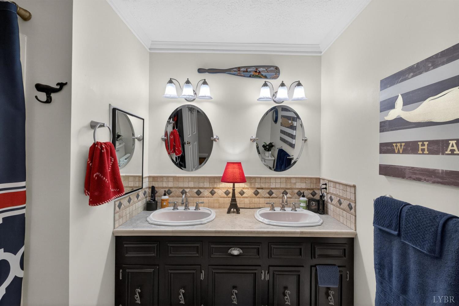 185 Clearview Circle Rustburg, VA 24588 - Photo 6 of 43 a bathroom with a double vanity sink and a mirror