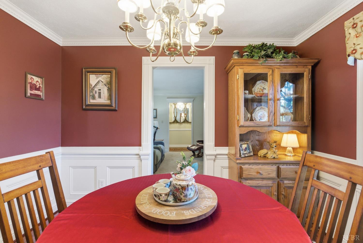 185 Clearview Circle Rustburg, VA 24588 - Photo 9 of 43 a view of a dining room with furniture a chandelier and wooden floor