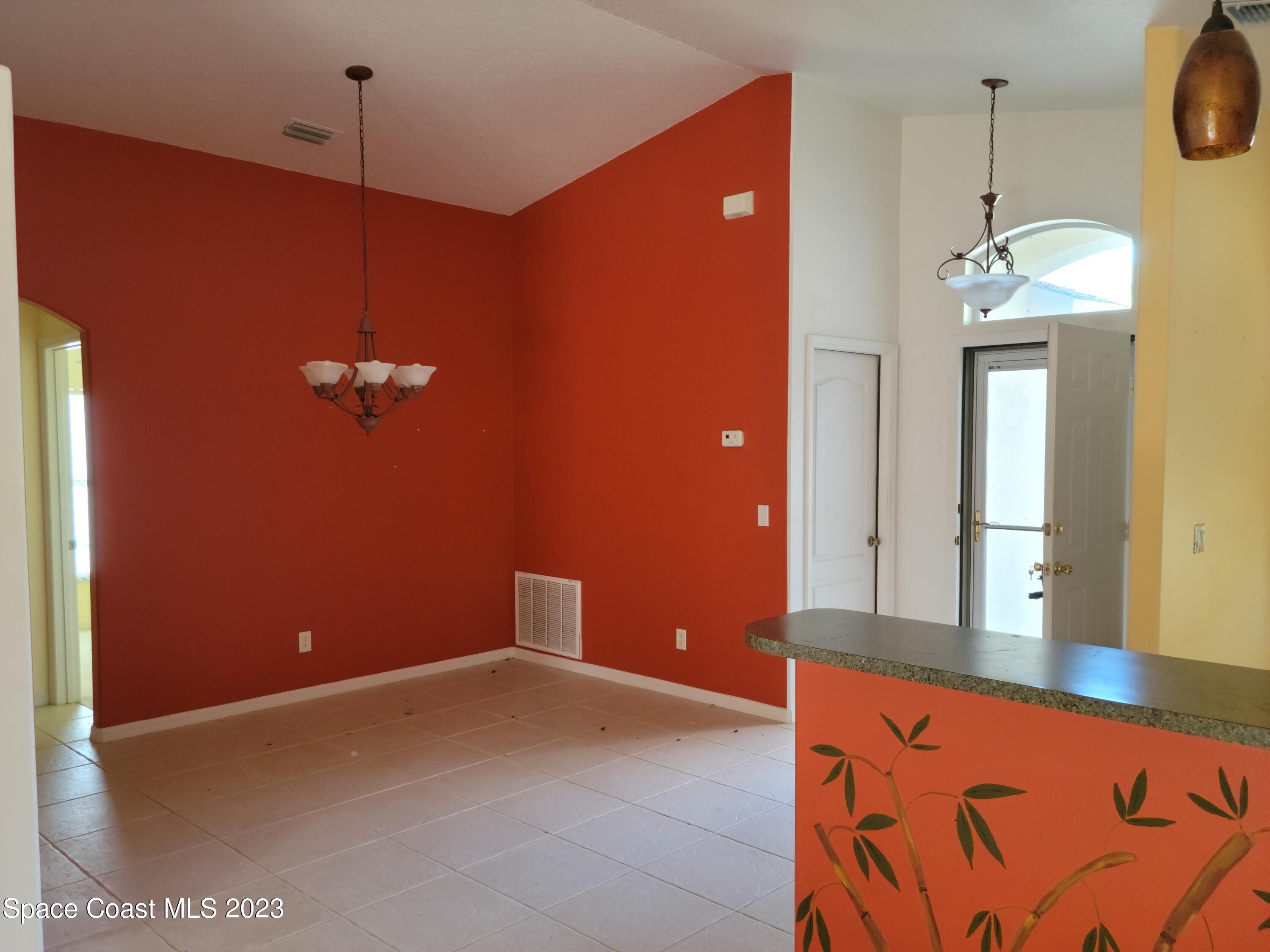 2219 Spring Creek Circle Palm Bay, FL 32905 - Photo 6 of 13 a view of a livingroom with a chandelier