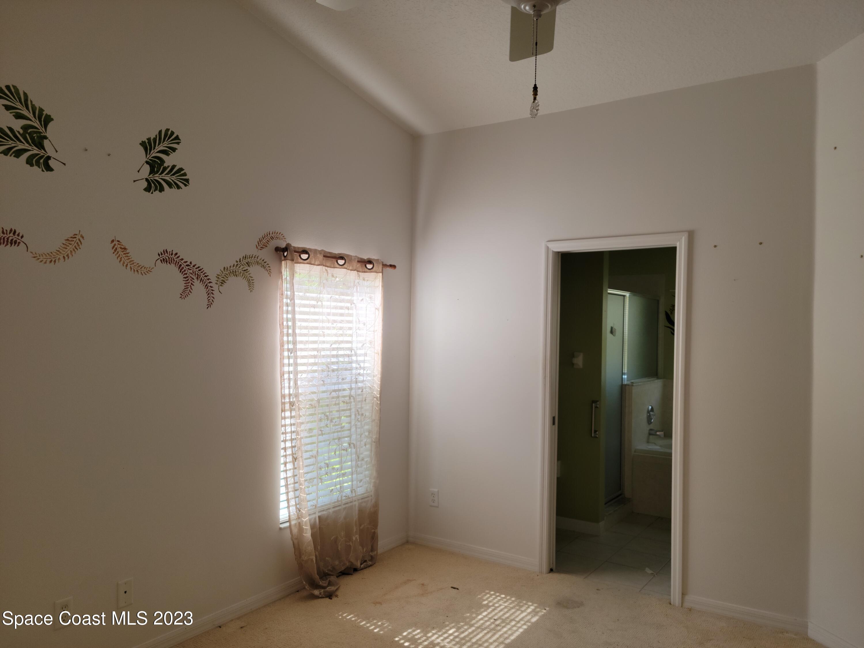 2219 Spring Creek Circle Palm Bay, FL 32905 - Photo 7 of 13 a view of an empty room with a window