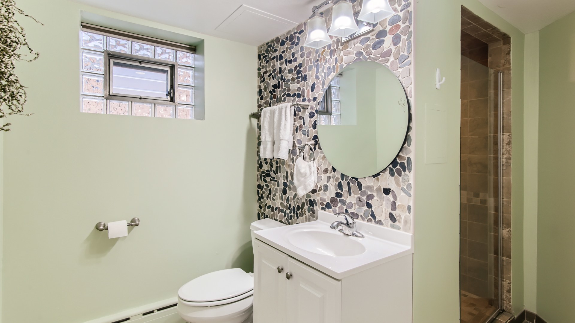 8739 West Sunset Road Niles, IL 60714 - Photo 12 of 14 a bathroom with a sink toilet and mirror