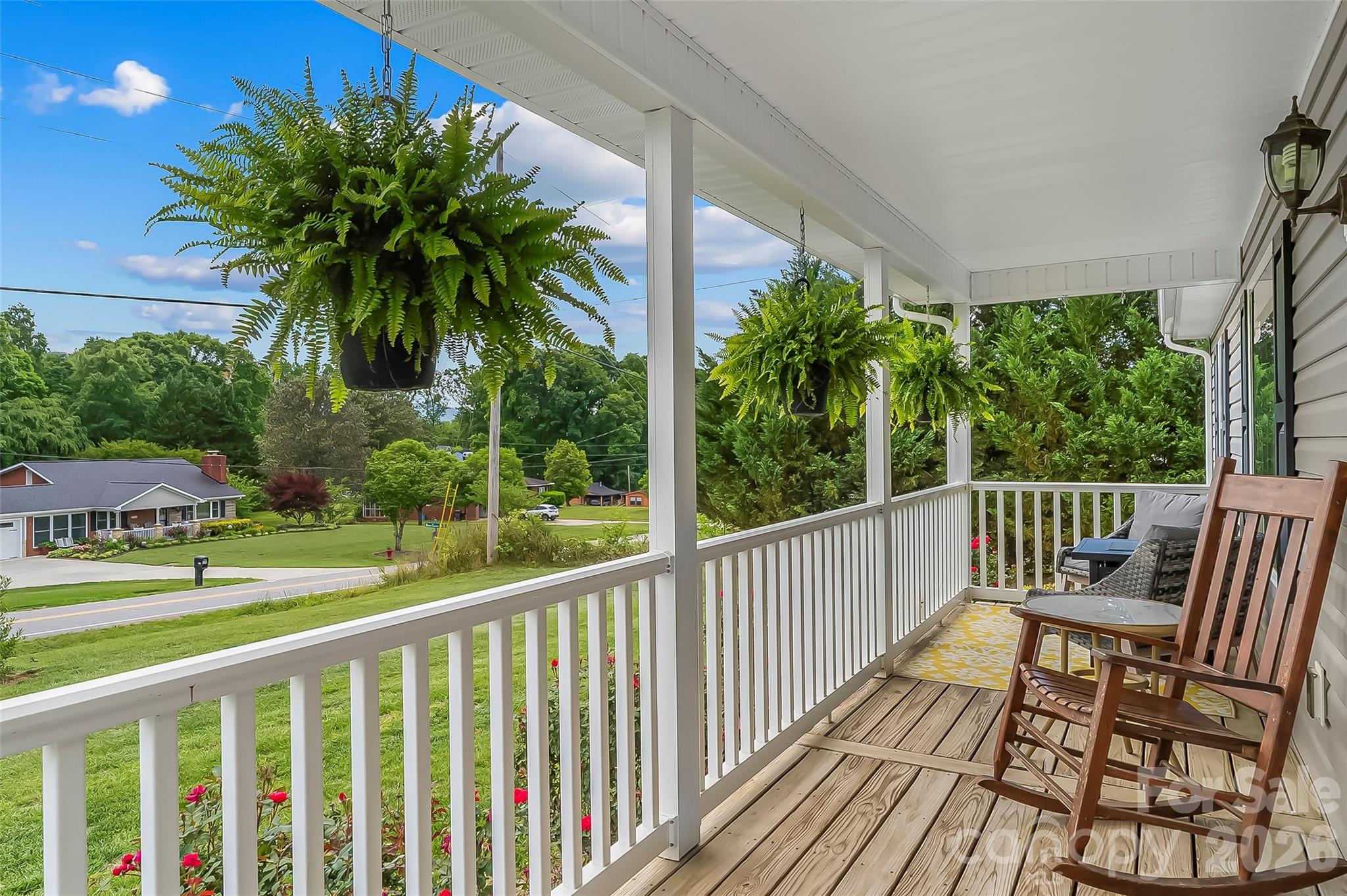 1498 Salem Road Morganton, NC 28655 - Photo 7 of 32 a view of a chair and tables in the balcony